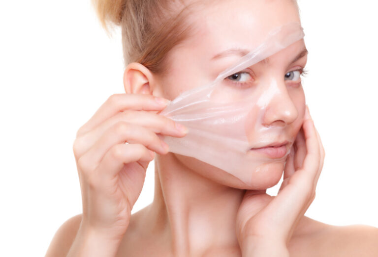 Girl woman in facial peel off mask. Skin care.